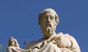 Sculpture of Plato with a blue sky background